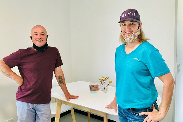 GIVIT's Lisa Herbert with Mallacoota resident Geoff Belmore, whose property was destroyed in the fires